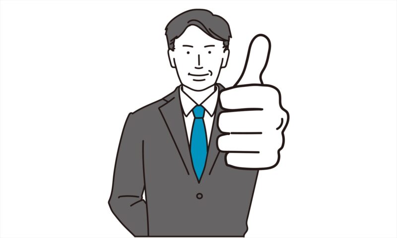 サムズアップする中年男性