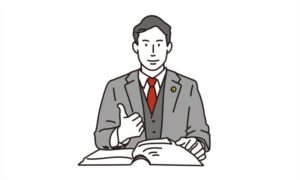 胸にバッジをつけた専門士業の男性