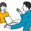 女性来訪者に説明する男性ビジネスパースン