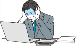 ミスして焦る男性ビジネスパーソン