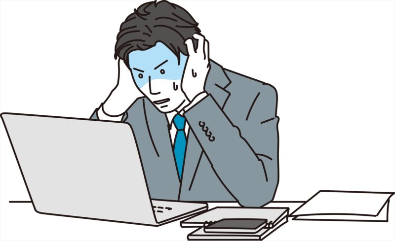 ミスして焦る男性ビジネスパーソン